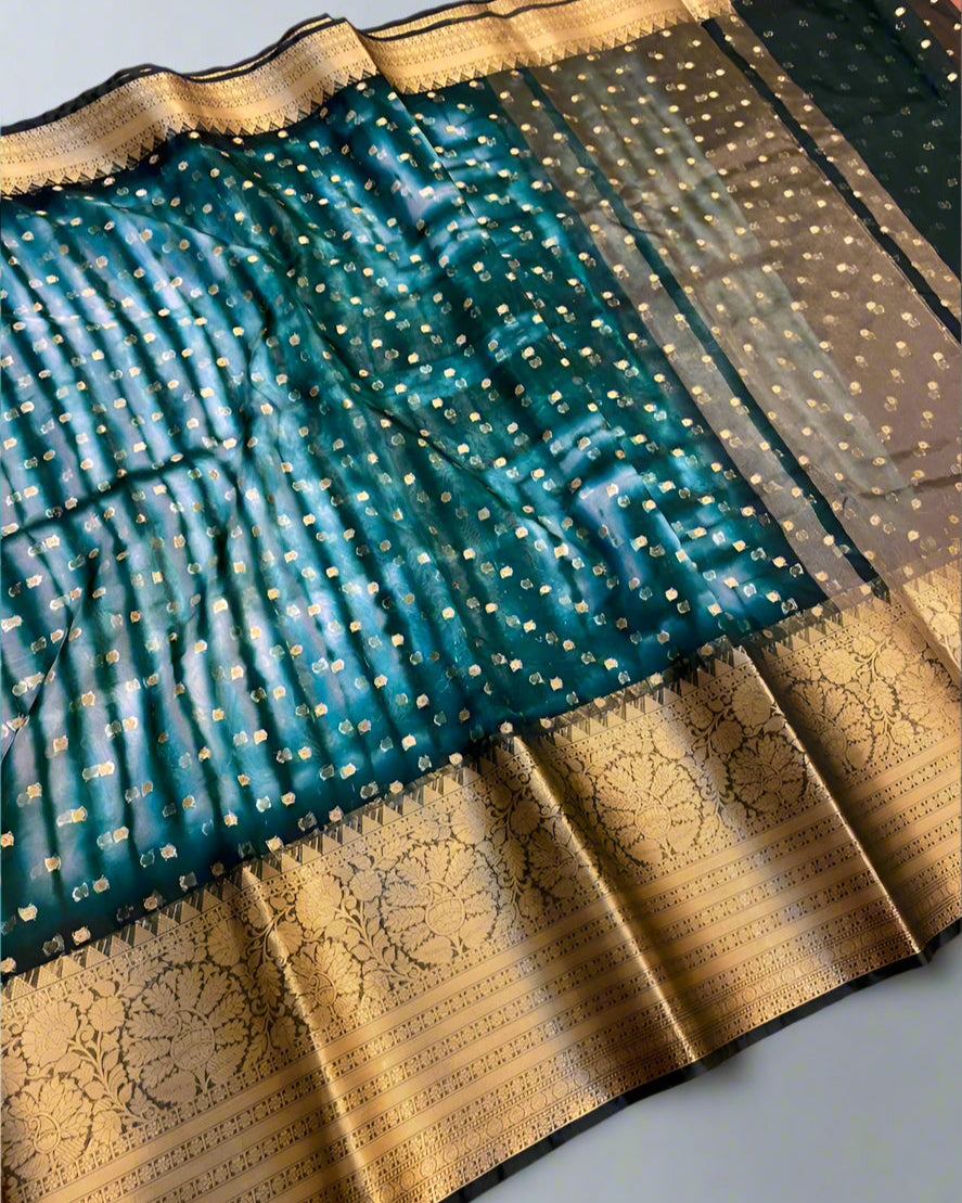 Teal and gold saree with a pattern