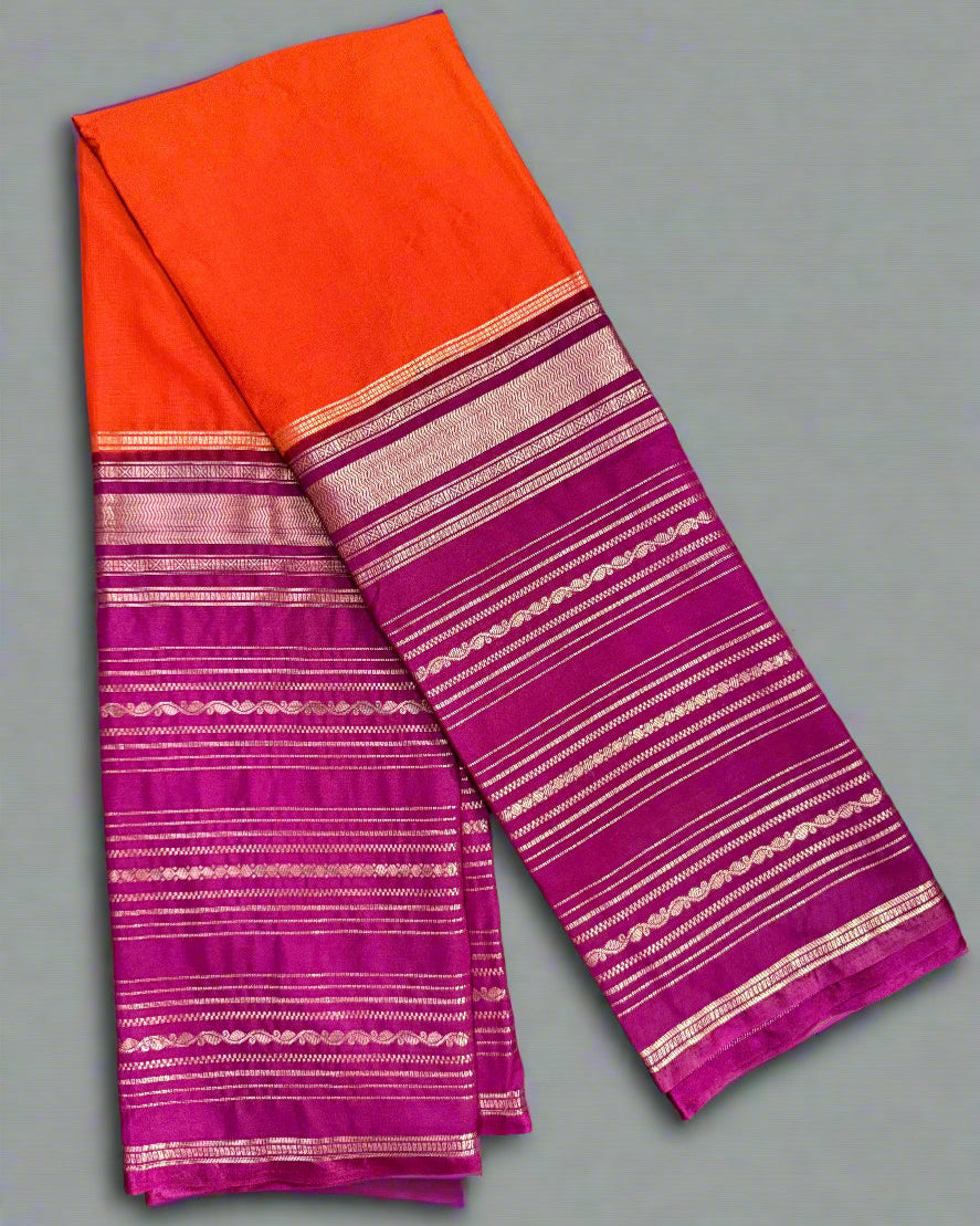 Saree with orange and pink striped pattern on a gray background