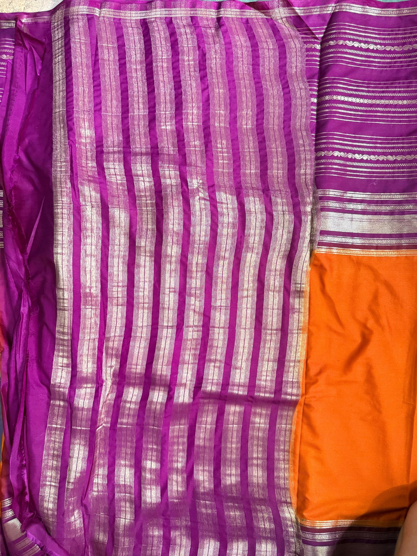 Purple and orange fabric with striped pattern