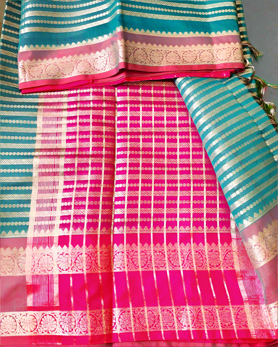 Colorful saree with pink and blue patterns on a green background