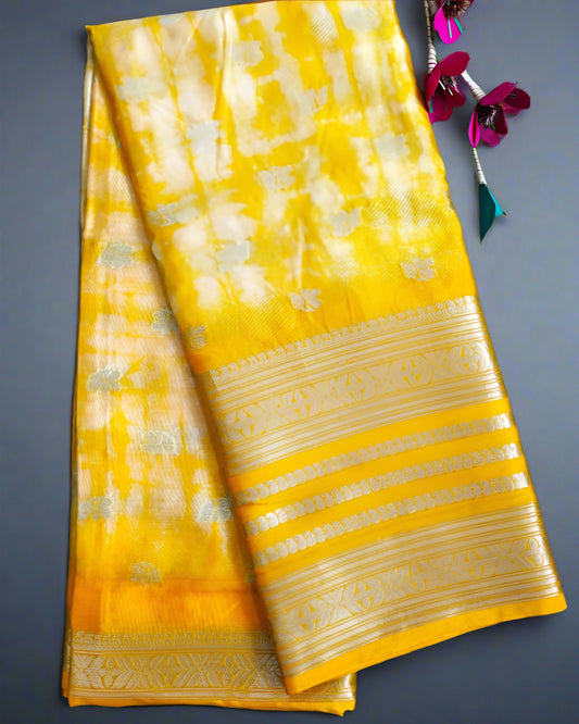 Yellow saree with white patterns