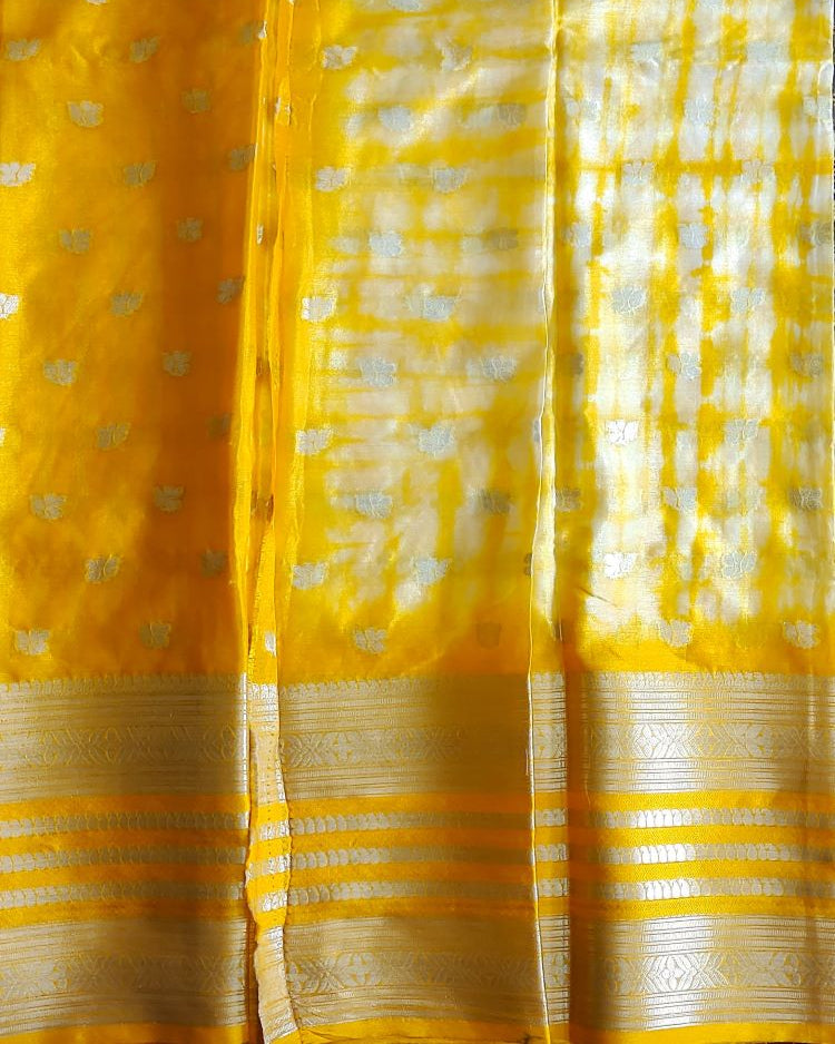 Yellow fabric with white patterns