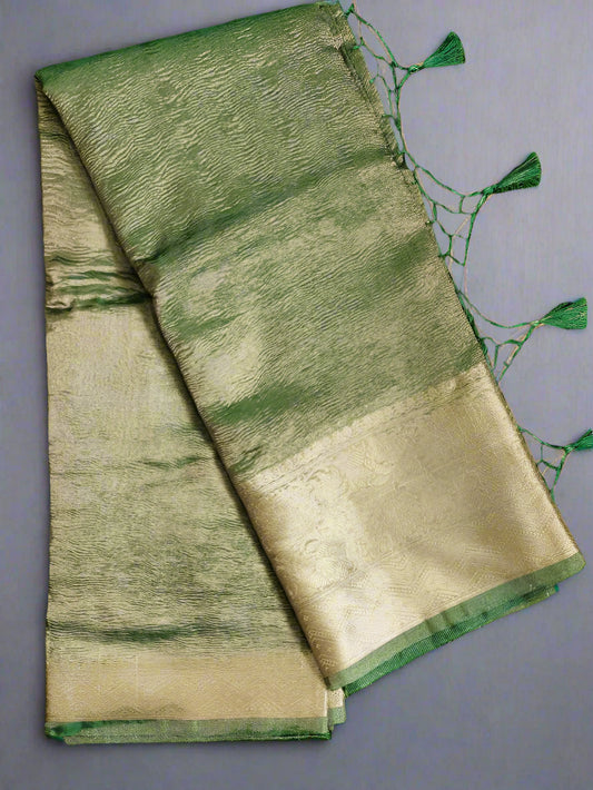 Green and beige saree on a green