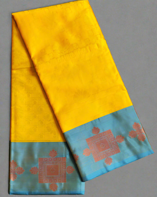 Yellow saree with blue border and red patterns