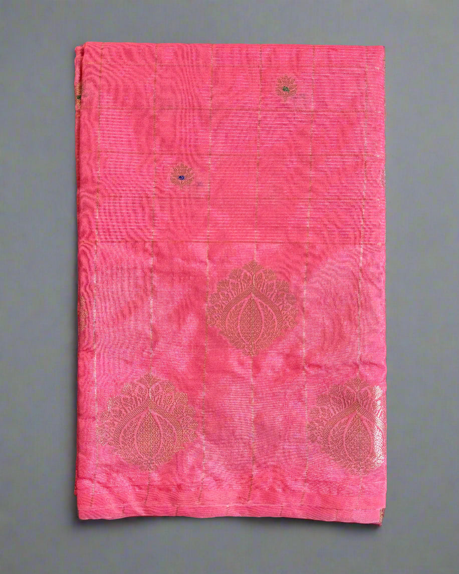 Pink fabric with embroidered patterns on a gray background