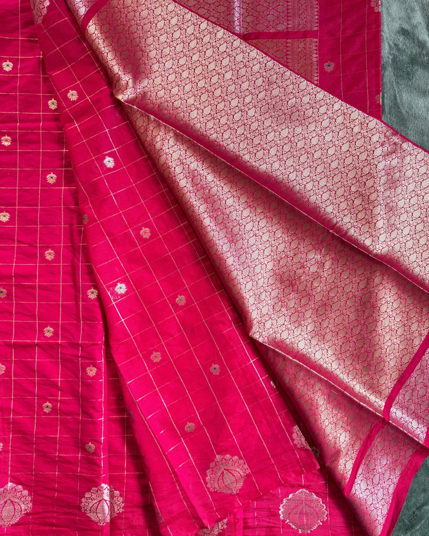 Red fabric with gold patterns and designs