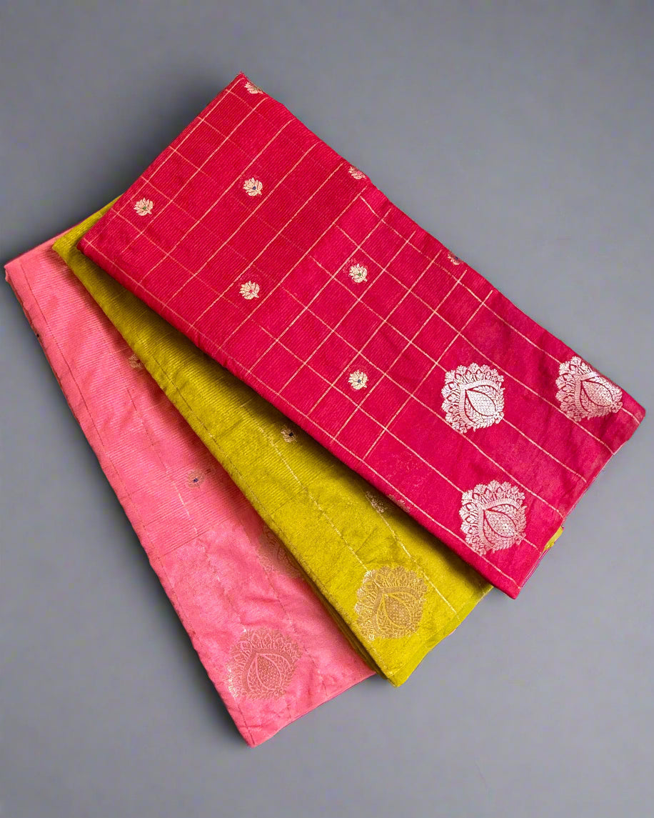 Three colorful fabric samples with patterns on a textured surface