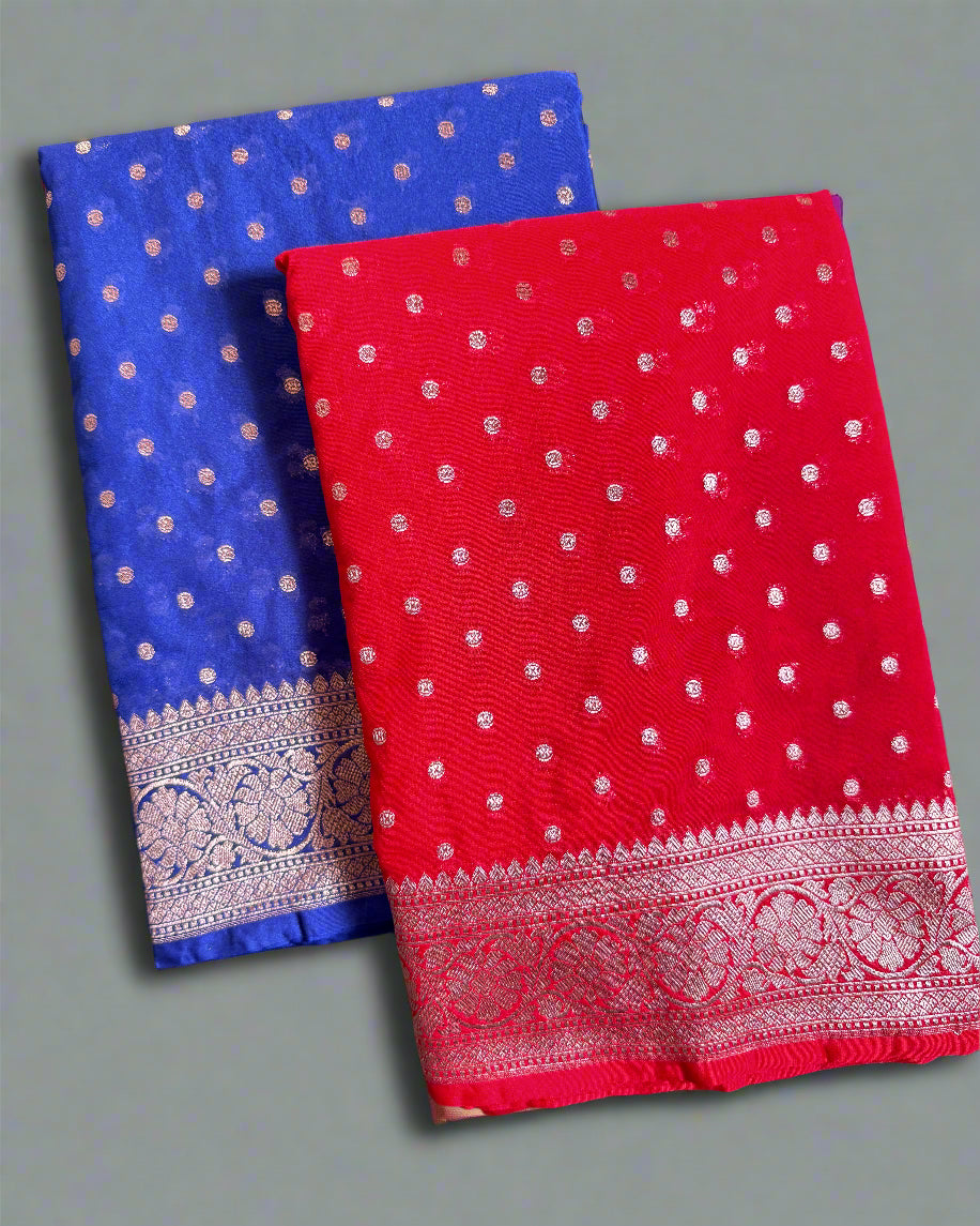 Two sarees, one blue and one red, with white patterns on a gray background