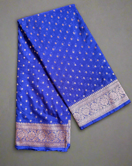 Blue fabric with white patterns on a gray background