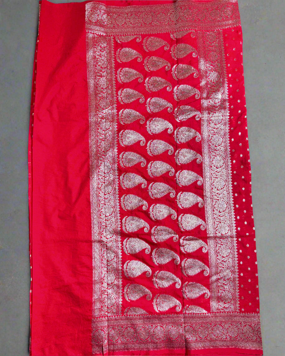 Red fabric with white pattern on a gray background