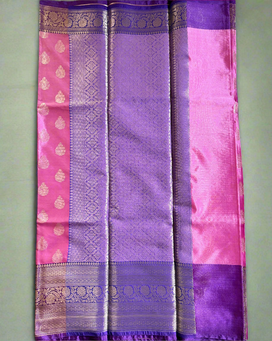 Purple and pink fabric with a woven pattern on a gray background