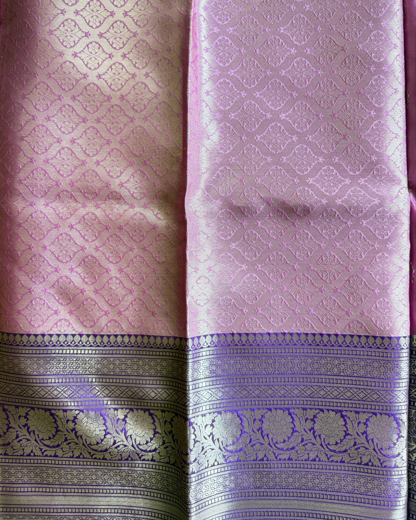 Purple and pink fabric with intricate patterns