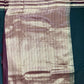 Striped fabric with a pattern on a dark background