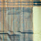 Sari with blue and gold pattern on a plain background
