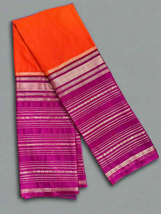 Saree with orange and pink striped pattern on a gray background