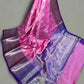 Purple and pink saree with a white background