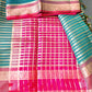 Colorful saree with pink and blue patterns on a green background