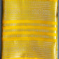 A handwoven yellow Banarasi silk saree displayed on a green background, featuring intricate buti patterns and a zari weave pallu.