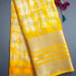 Yellow saree with white patterns