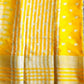 Yellow fabric with white patterns