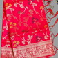 Red fabric with floral patterns on a gray background