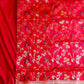 Red saree with floral patterns and a border