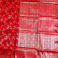 Red fabric with floral pattern on one side and geometric pattern on the other