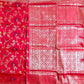Red saree with floral patterns and geometric designs