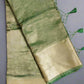Green and beige saree on a green 