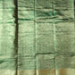 Green fabric with a subtle pattern and gold border