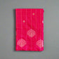 Pink fabric with white patterns on a gray textured background