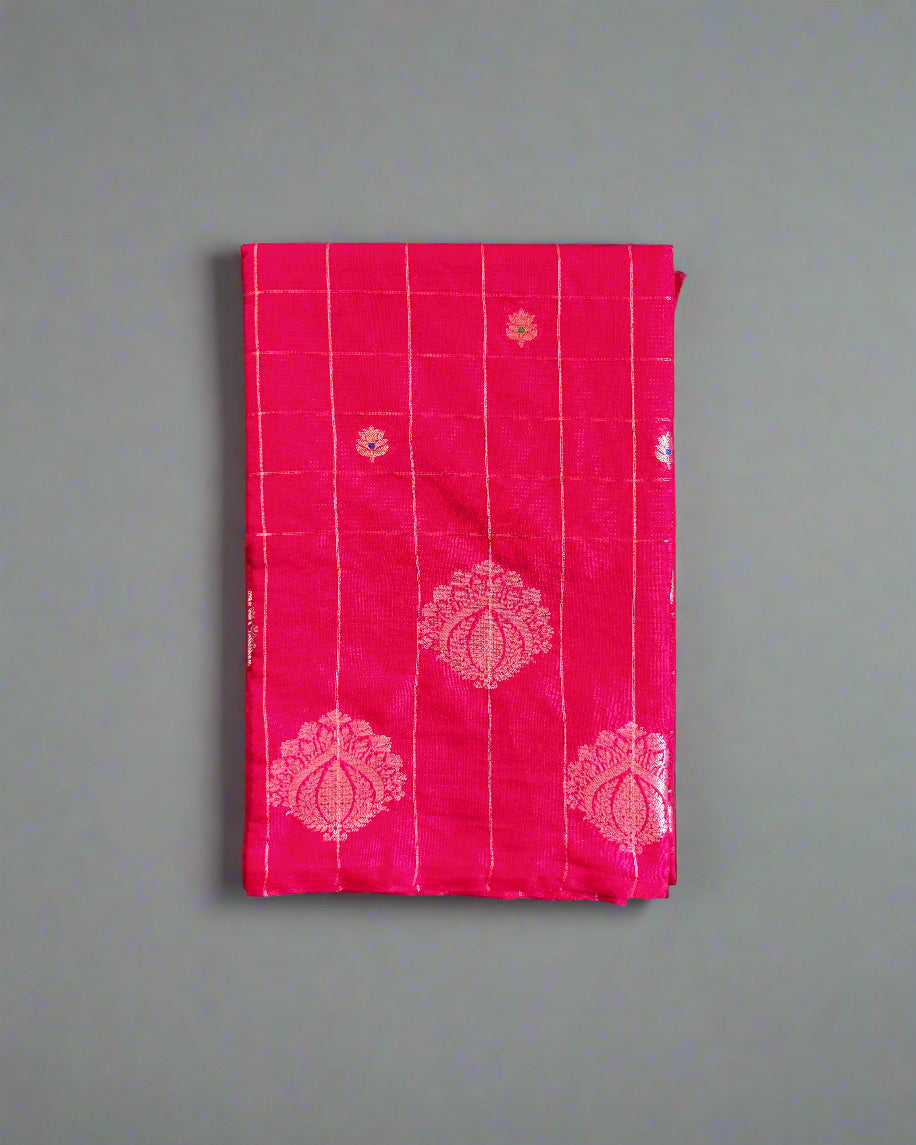 Pink fabric with white patterns on a gray textured background