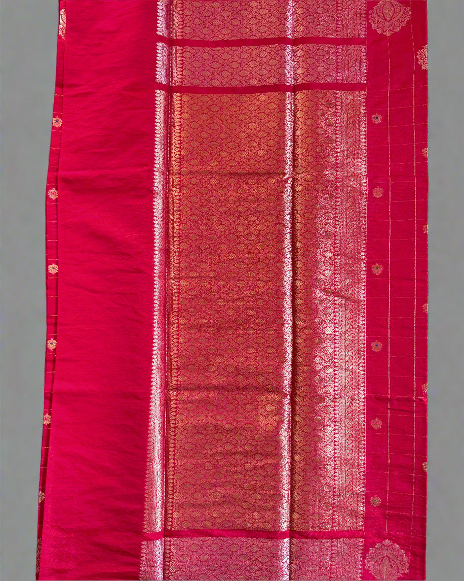 Red fabric with intricate patterns on a gray background