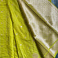 Close-up of green fabric with gold patterns