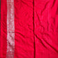 Red fabric with intricate patterns on a flat surface