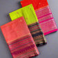 Three colorful fabric pouches on a textured gray surface