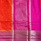 Saree with pink and orange patterned border on a plain background
