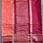Saree with a checkered pattern on a green background