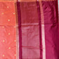 Saree with a checkered pattern on a green background