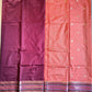 Two sarees, one pink and one maroon, with decorative borders on a blue background.