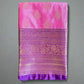 Pink and purple fabric with intricate patterns on a gray surface