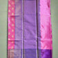 Purple and pink fabric with a woven pattern on a gray background
