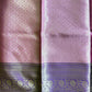 Purple and pink fabric with intricate patterns