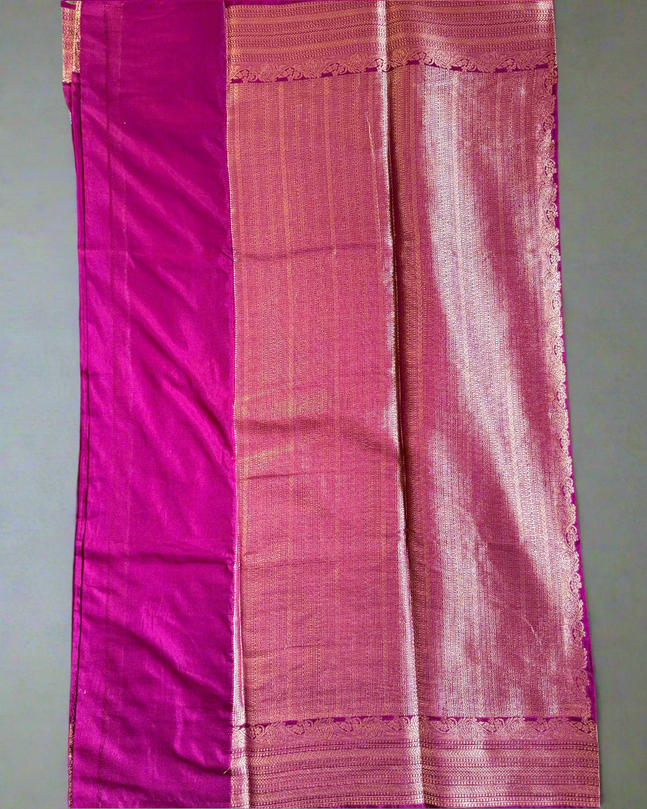 Purple fabric with a striped pattern on a gray surface
