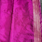 Close-up of purple fabric with intricate border