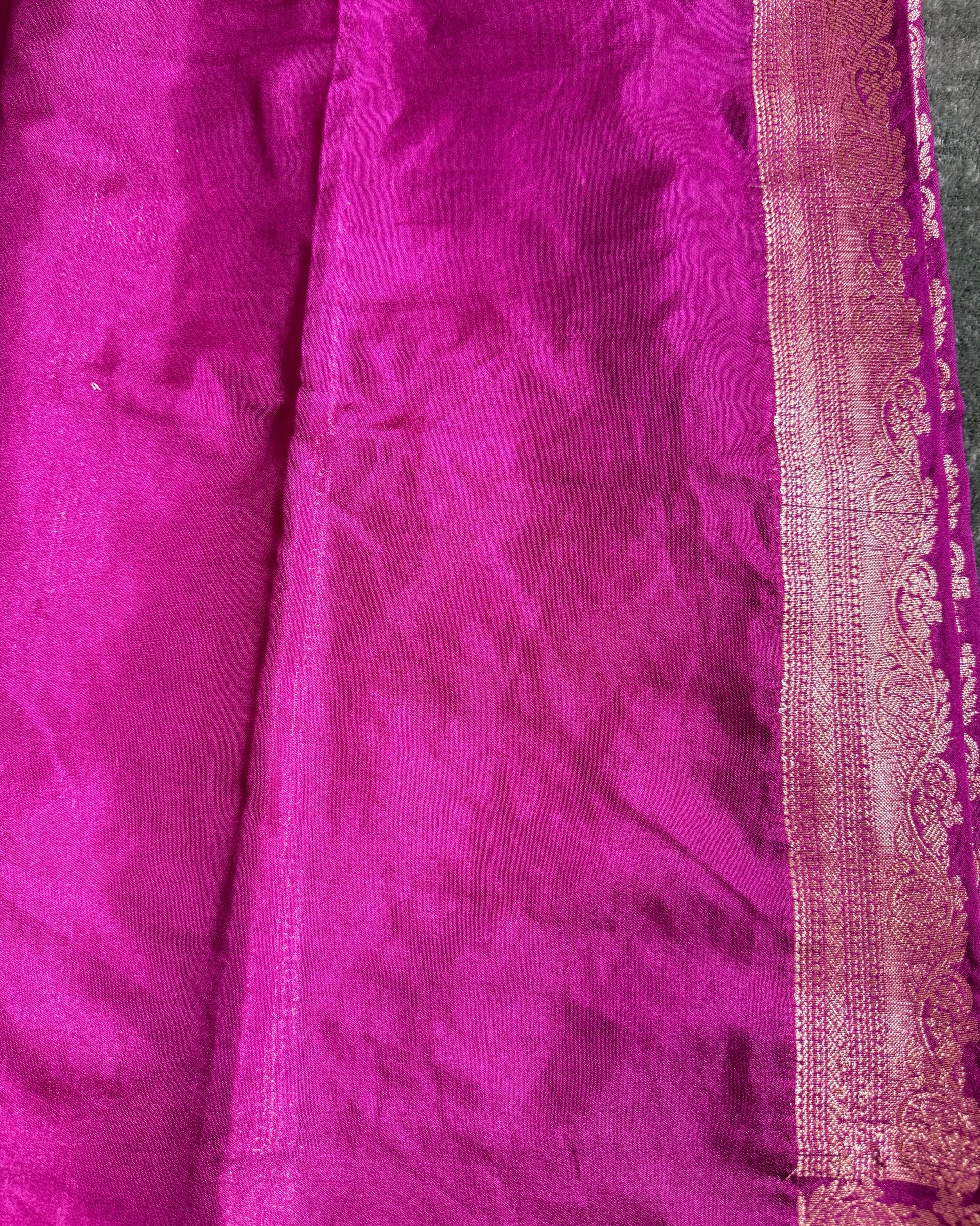 Close-up of purple fabric with intricate border