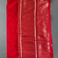 Red fabric on a textured gray surface