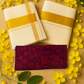 The image shows an off-white Kerala Kasavu saree with a golden zari border, accompanied by a running blouse piece and additional random blouse pieces, displayed on a background with yellow flowers and green leaves.