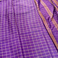 Purple fabric with a grid pattern and purple border