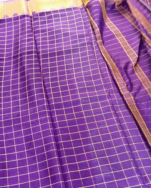 Purple fabric with a grid pattern and purple border
